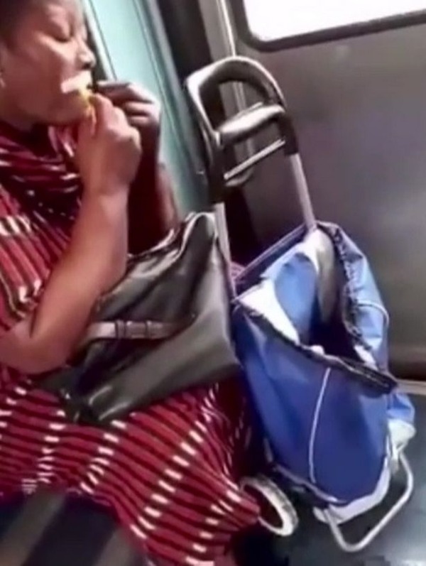 Woman-casually-shaves-her-facial-hair-on-public-transport